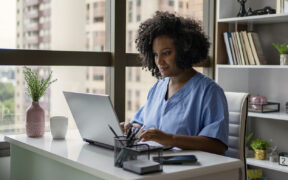 A person working on the computer Description automatically generated with medium confidence