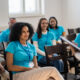 A group of people sitting in chairs Description automatically generated