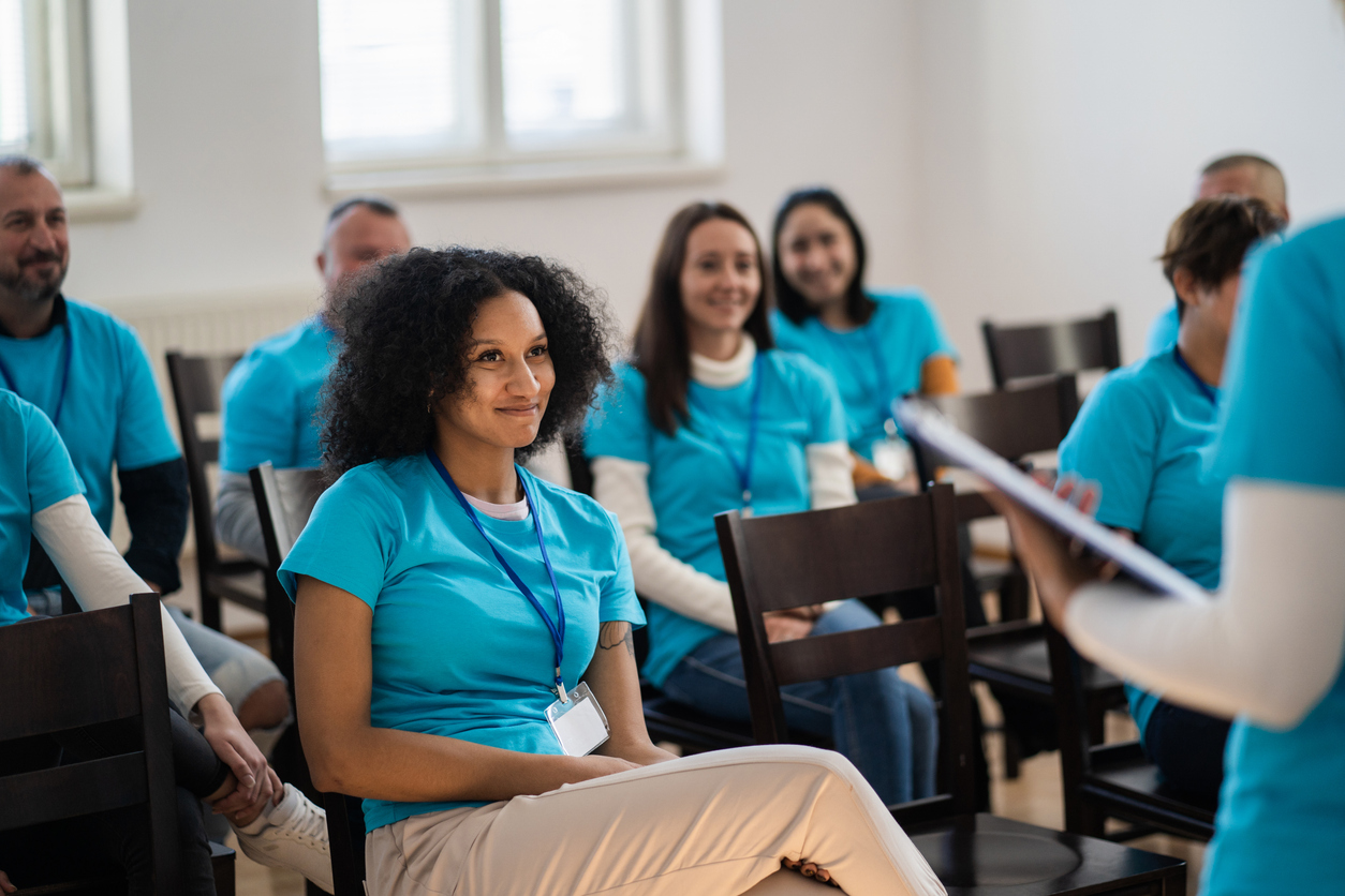 A group of people sitting in chairs Description automatically generated