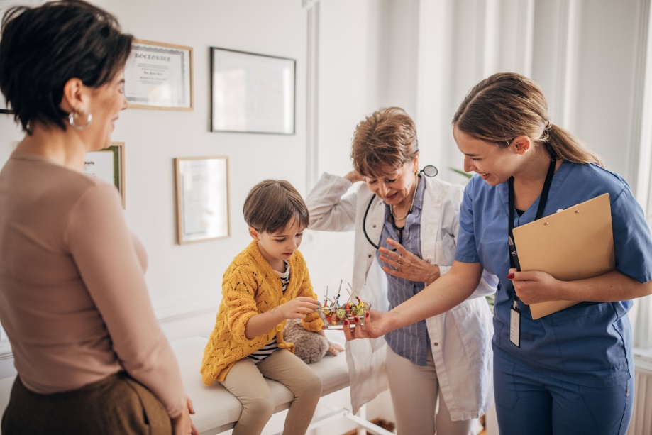 A group of people in a room Description automatically generated